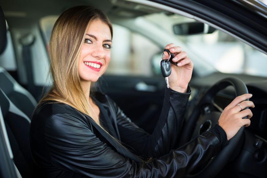 Woman Driving a Black Car