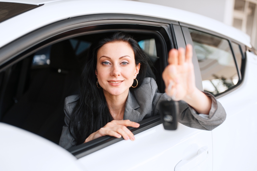 Woman Driving a White Car
