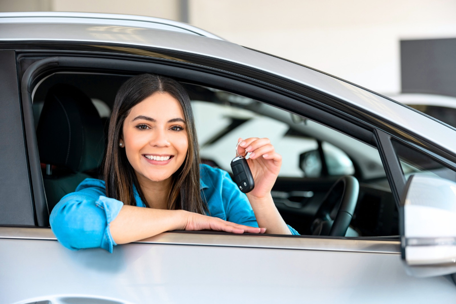 Woman Driving a White Car