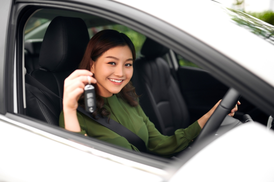 Woman Driving a White Car